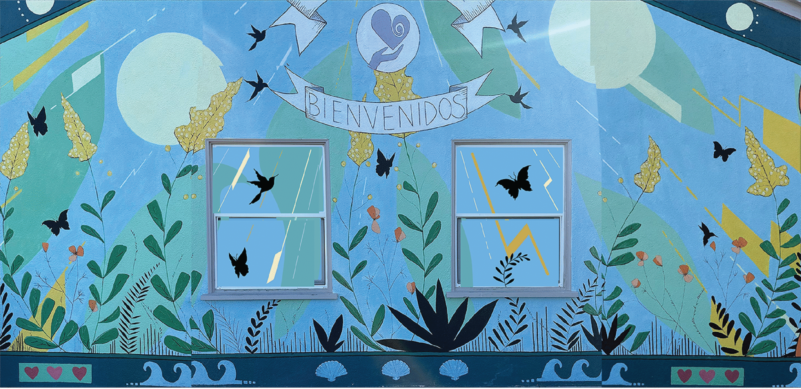 Mural was pre-existing.  I designed the window pieces to blend in and merge with the wall mural, as if it was all designed at once.  